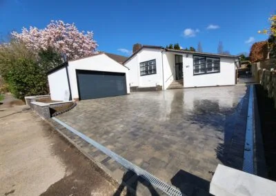 Garage exterior and paved courtyard from the GB gallery