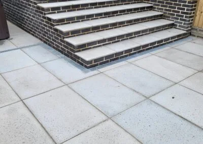 Wide paved steps between garden levels